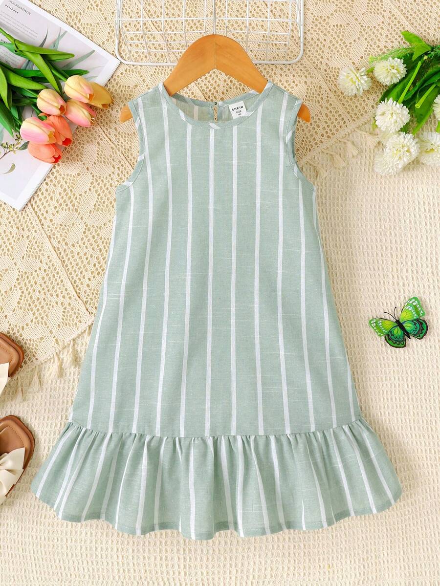 Tween girls blue denim effect sleeveless dress with round neck, button front details, and flounce hem.
