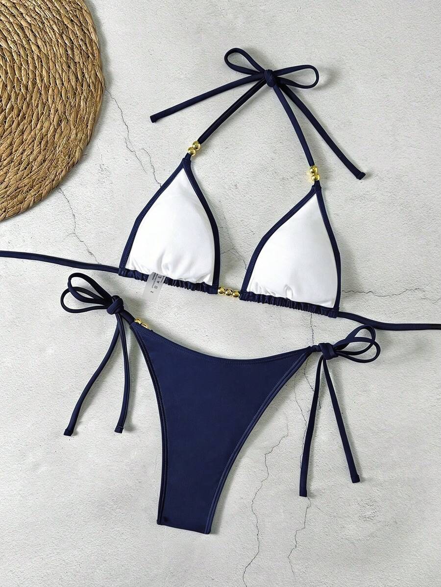Women's black halter bikini set featuring triangle cups with gold bead decor and tie-back closure
