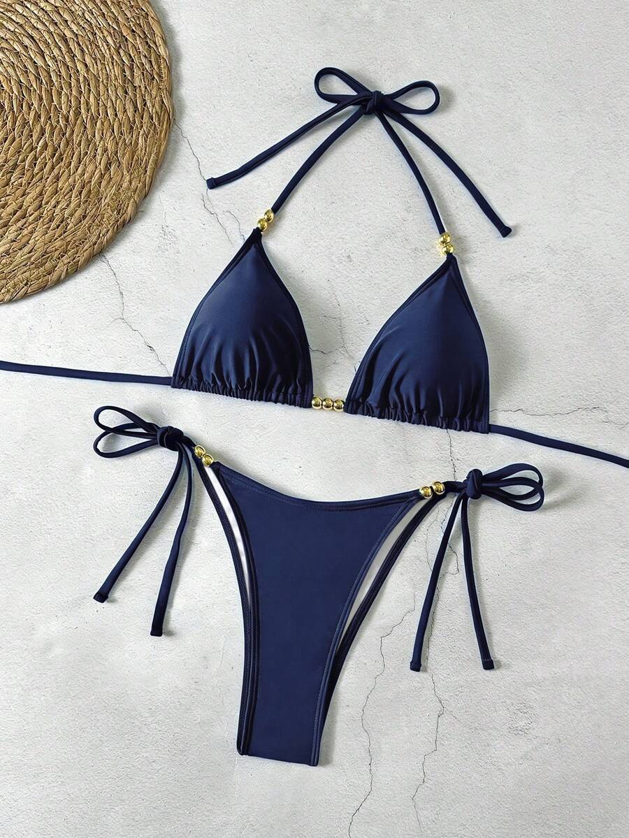 Women's black halter bikini set featuring triangle cups with gold bead decor and tie-back closure
