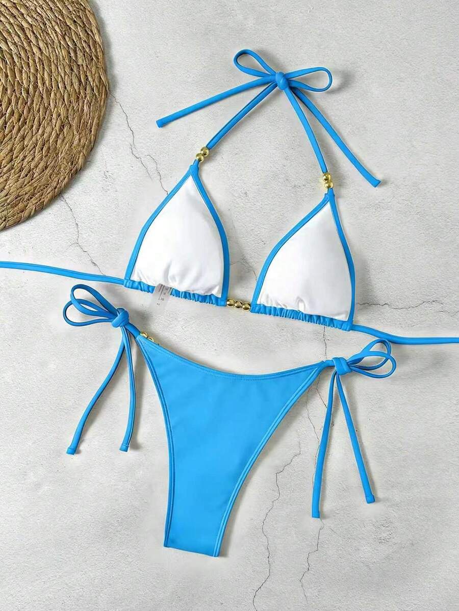 Women's black halter bikini set featuring triangle cups with gold bead decor and tie-back closure