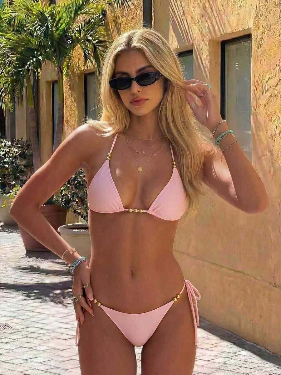 Women's black halter bikini set featuring triangle cups with gold bead decor and tie-back closure