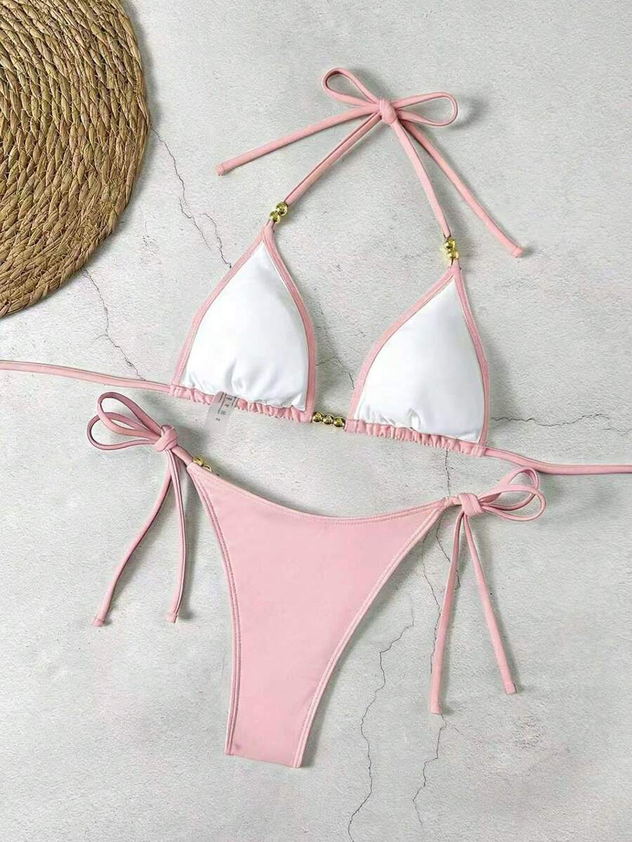 Women's black halter bikini set featuring triangle cups with gold bead decor and tie-back closure