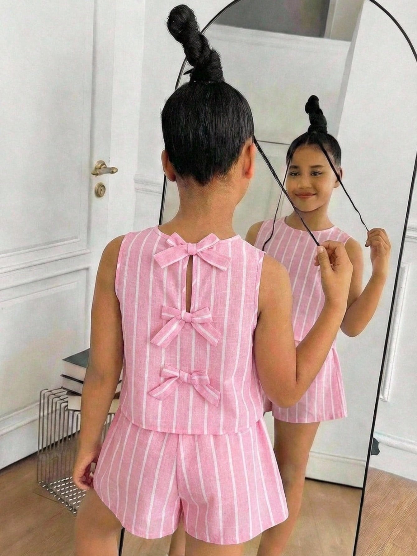 Tween girls casual blue tank top featuring round neck, textured fabric, and bow detail paired with matching shorts set.