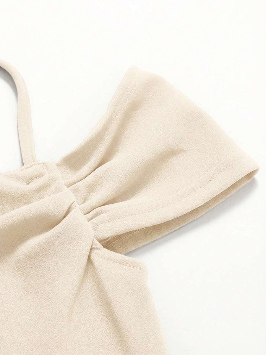 Apricot velvet A-line midi dress for tween girls featuring cold shoulder short sleeves, spaghetti straps, and a high waist.