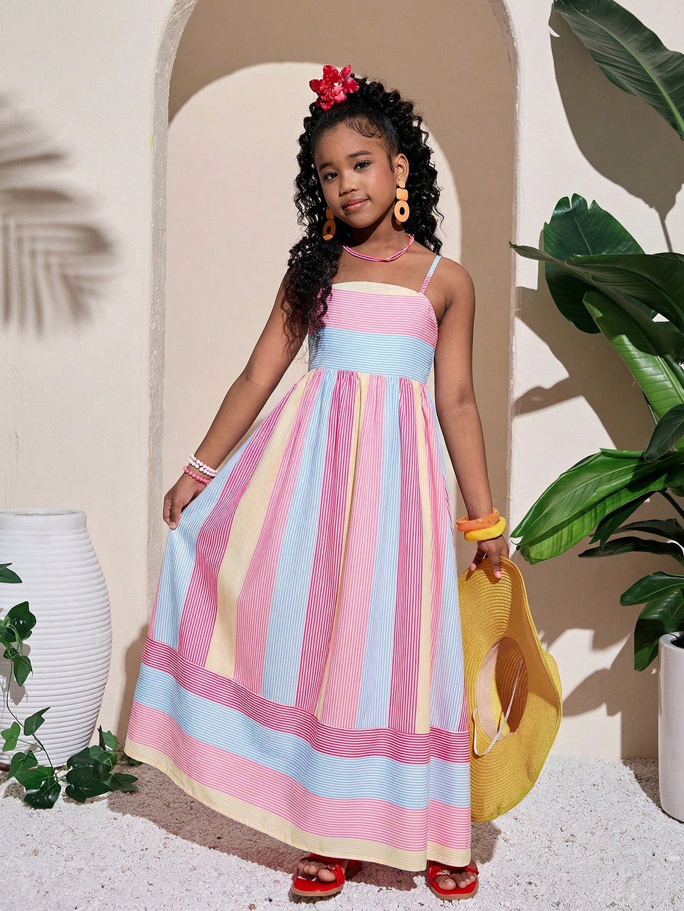Tween girls striped spaghetti strap cami dress with high waist, shirred detail, zipper closure, sleeveless design, and flared long A-line silhouette for vacation wear.