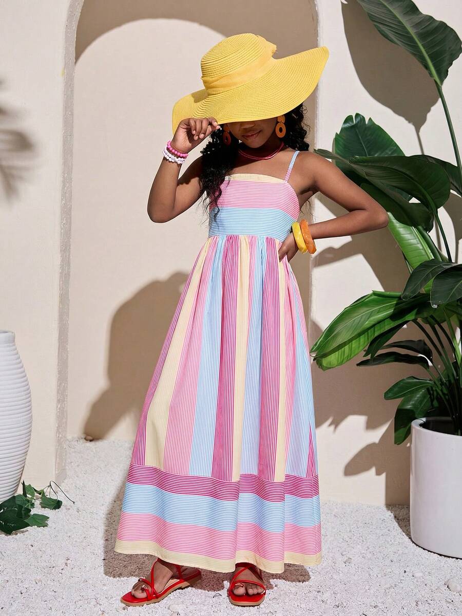 Tween girls blue striped summer camisole dress featuring spaghetti straps, high waist, flared hem, and back zipper detail.