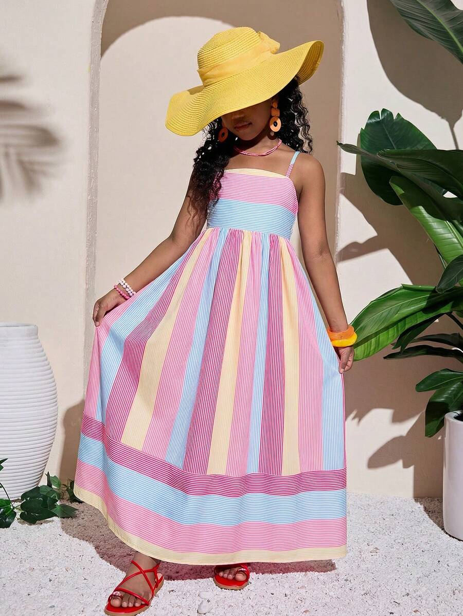 Tween girls blue striped summer camisole dress featuring spaghetti straps, high waist, flared hem, and back zipper detail.