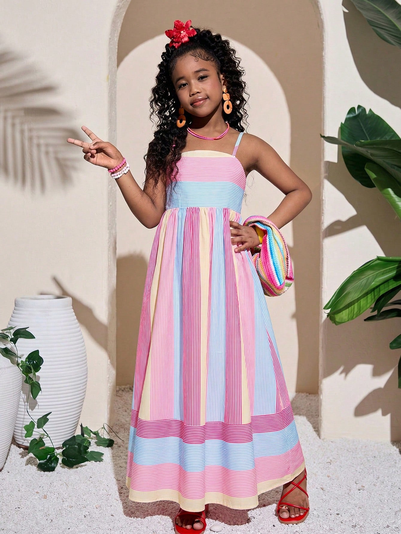 Tween girls striped spaghetti strap cami dress with high waist, shirred detail, zipper closure, sleeveless design, and flared long A-line silhouette for vacation wear.