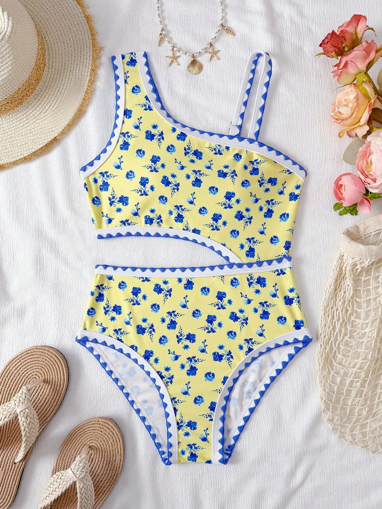 Tween girls one-piece swimsuit featuring an asymmetric neckline, pendant decor, plain design, wireless bra, high-cut bottom, and medium-stretch fabric.