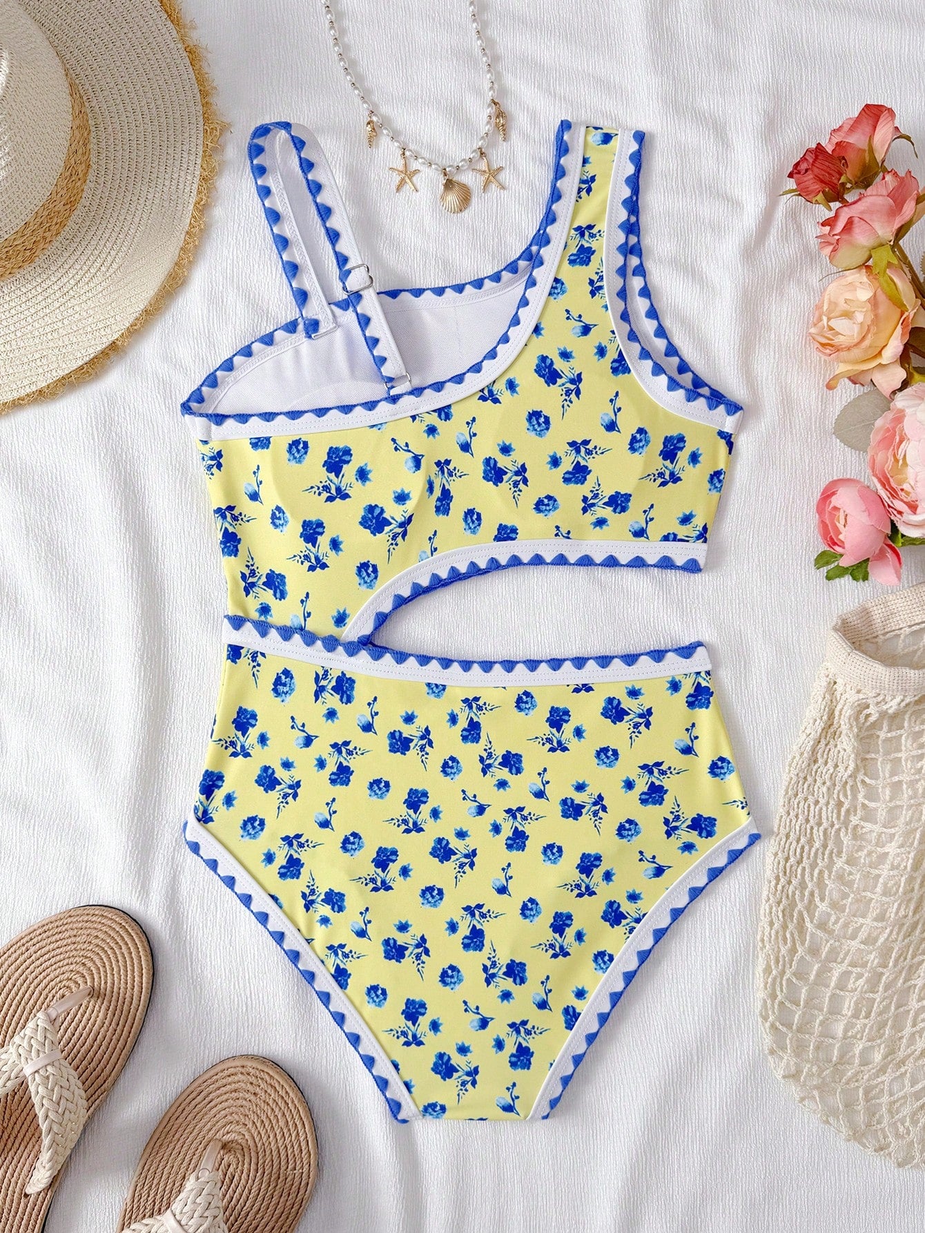 Tween girls one-piece swimsuit featuring an asymmetric neckline, pendant decor, plain design, wireless bra, high-cut bottom, and medium-stretch fabric.