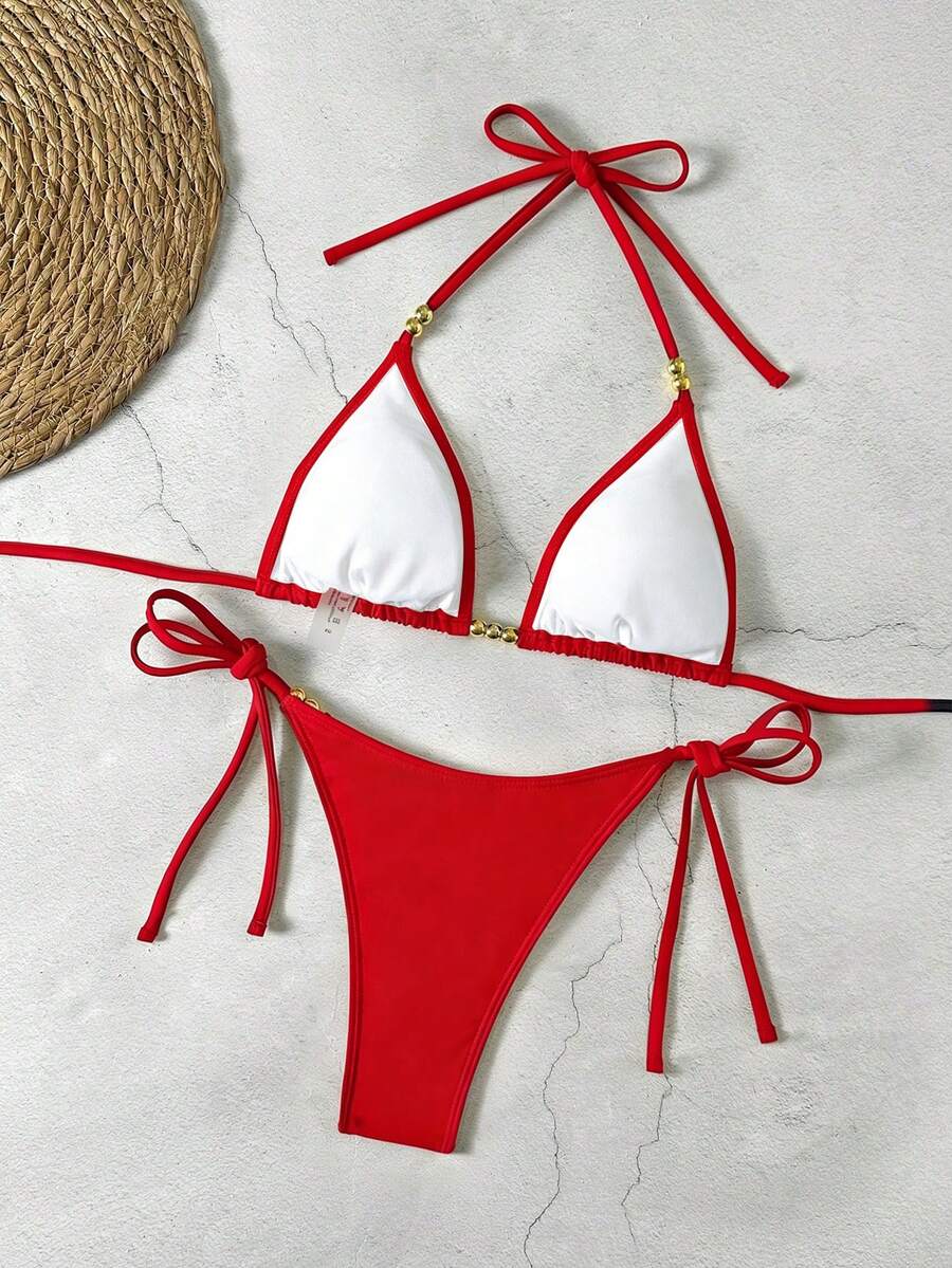 Women's black halter bikini set featuring triangle cups with gold bead decor and tie-back closure