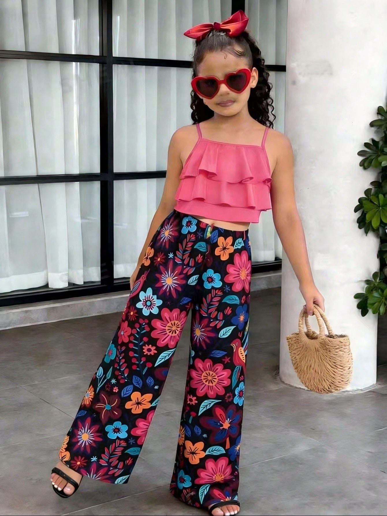 Tween girls blue 2-piece vacation outfit set featuring a tiered ruffle spaghetti strap camisole and loose high-waist pants.