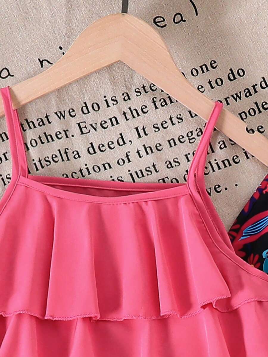 Tween girls blue 2-piece vacation outfit set featuring a tiered ruffle spaghetti strap camisole and loose high-waist pants.