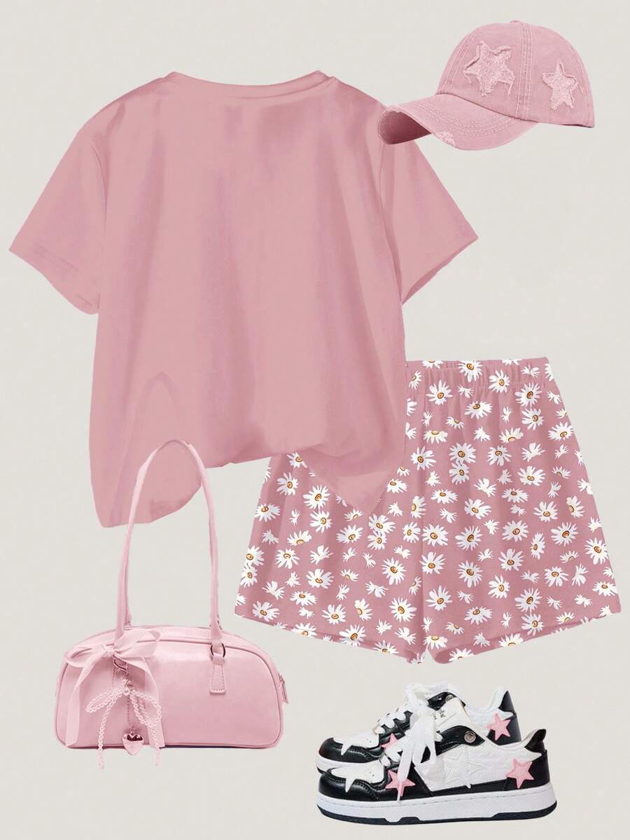 Tween girls 2-piece summer casual outfit featuring a multicolor seashell print short sleeve T-shirt with drop shoulders and matching loose fit shorts with pockets.