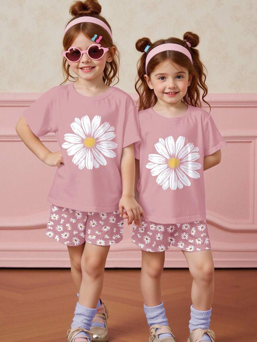 Tween girls 2-piece summer casual outfit featuring a multicolor seashell print short sleeve T-shirt with drop shoulders and matching loose fit shorts with pockets.