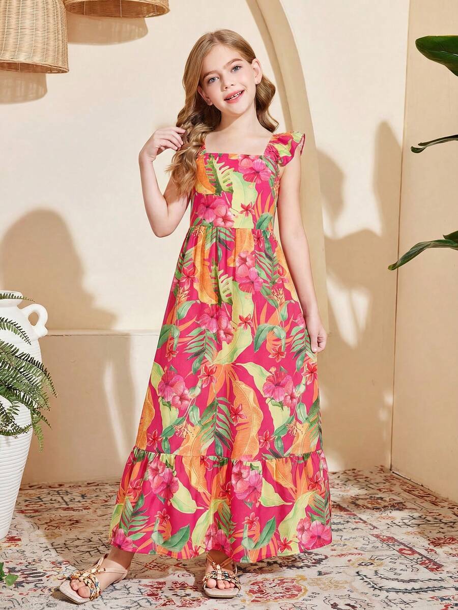 Blue floral print long vacation dress for tween girls featuring an A-line high waist silhouette with ruffle details and spaghetti straps.