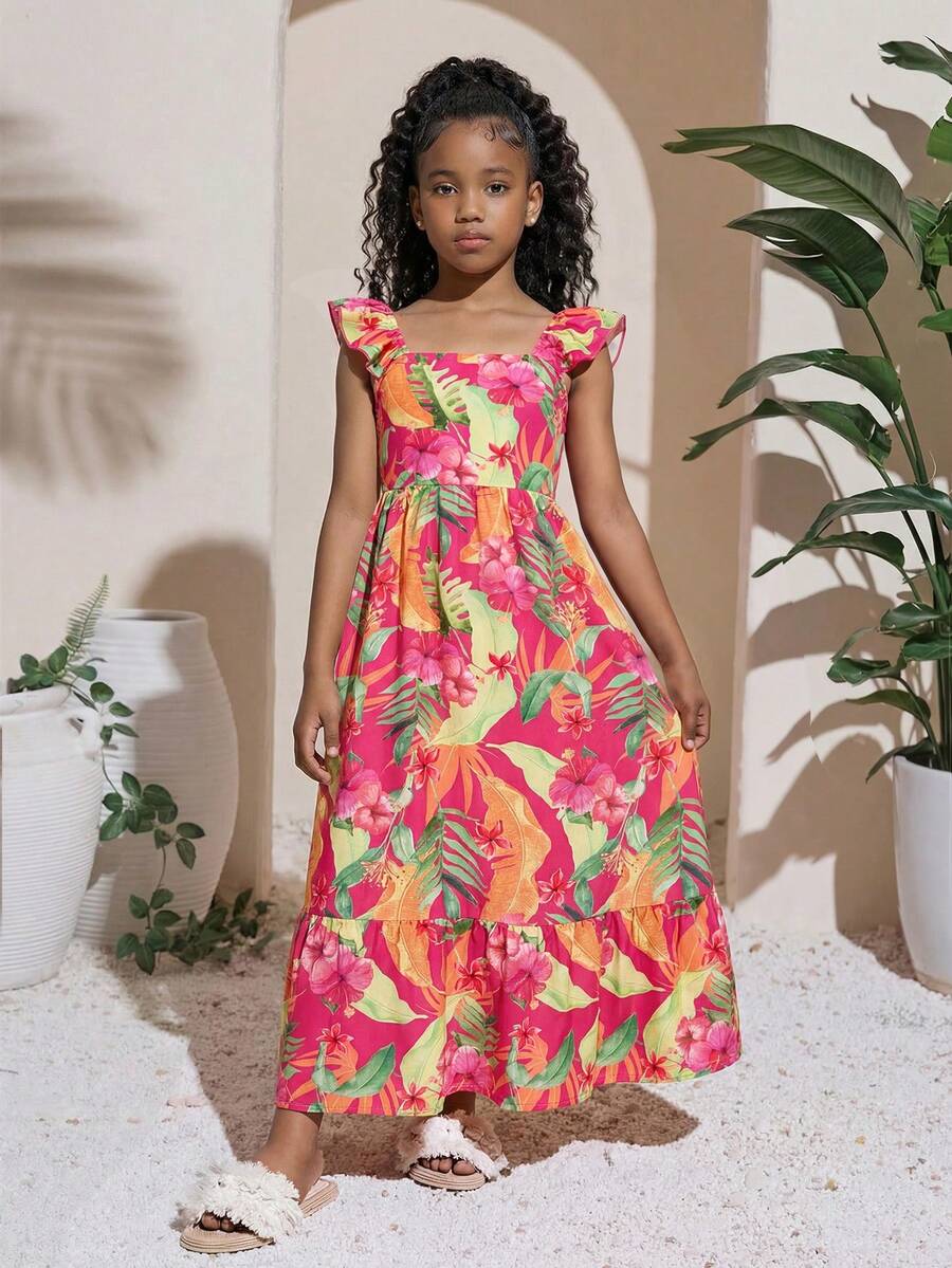 Blue floral print long vacation dress for tween girls featuring an A-line high waist silhouette with ruffle details and spaghetti straps.
