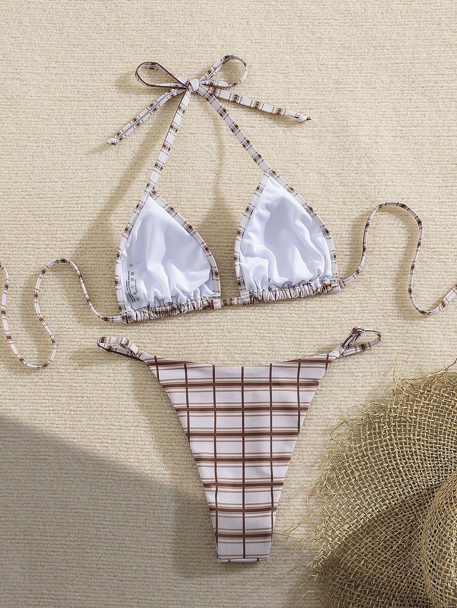 Multicolor bohemian bikini set for women featuring a backless halter top with knot details and high cut swimsuit bottoms.