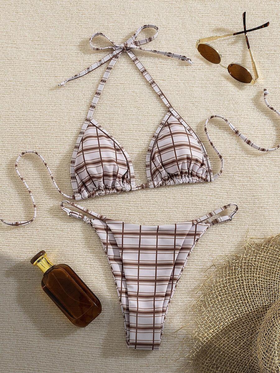 Multicolor bohemian bikini set for women featuring a backless halter top with knot details and high cut swimsuit bottoms.