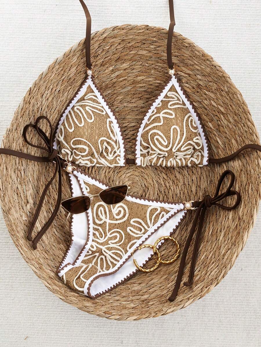 Women's triangle bikini set with contrast lace wireless bra top and ultra high waist tie side bottoms.