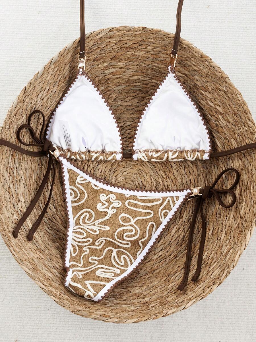 Women's triangle bikini set with contrast lace wireless bra top and ultra high waist tie side bottoms.