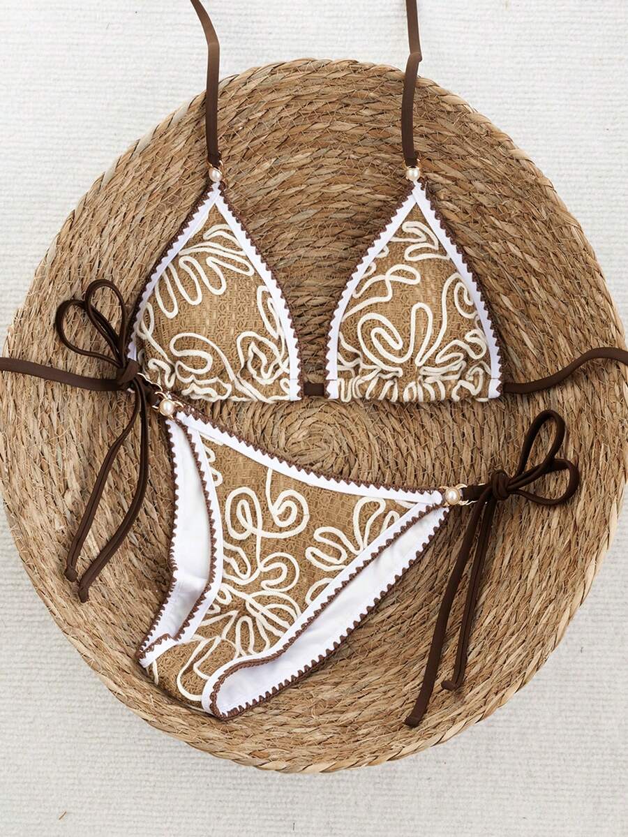 Women's triangle bikini set with contrast lace wireless bra top and ultra high waist tie side bottoms.