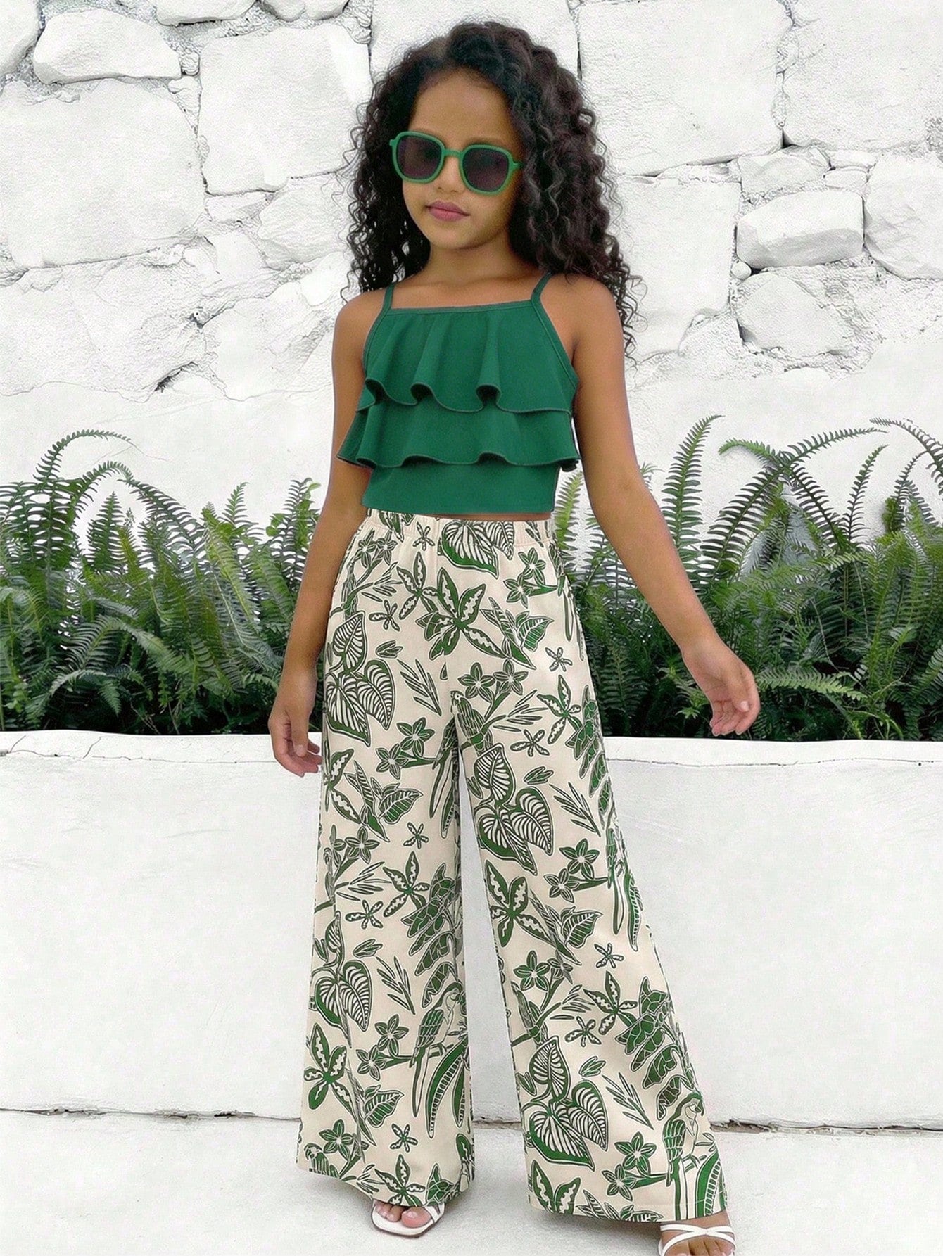 Tween girls blue 2-piece vacation outfit set featuring a tiered ruffle spaghetti strap camisole and loose high-waist pants.
