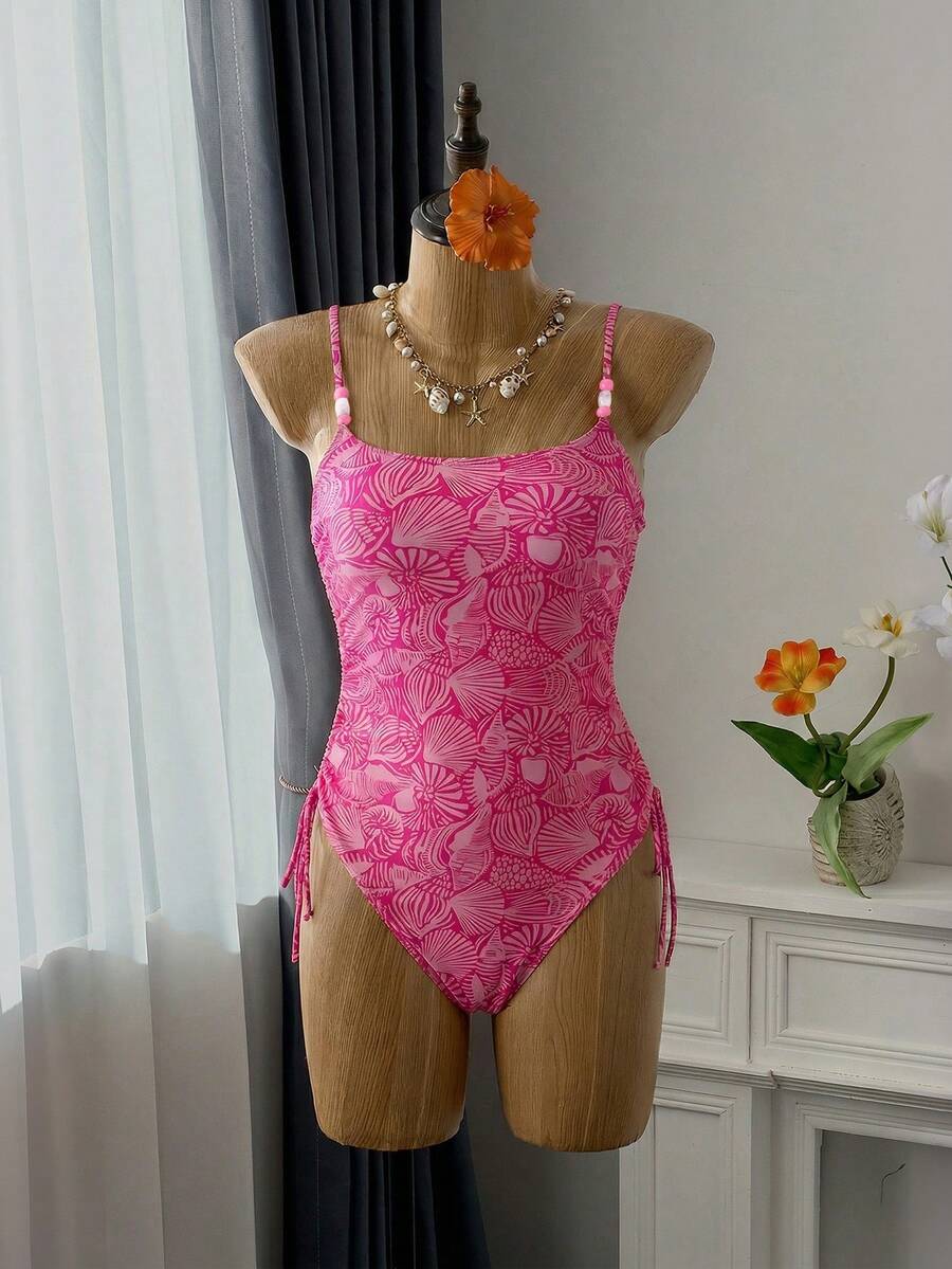 Women's blue backless one-piece swimsuit featuring spaghetti straps, wireless bra with removable padding, and drawstring details.