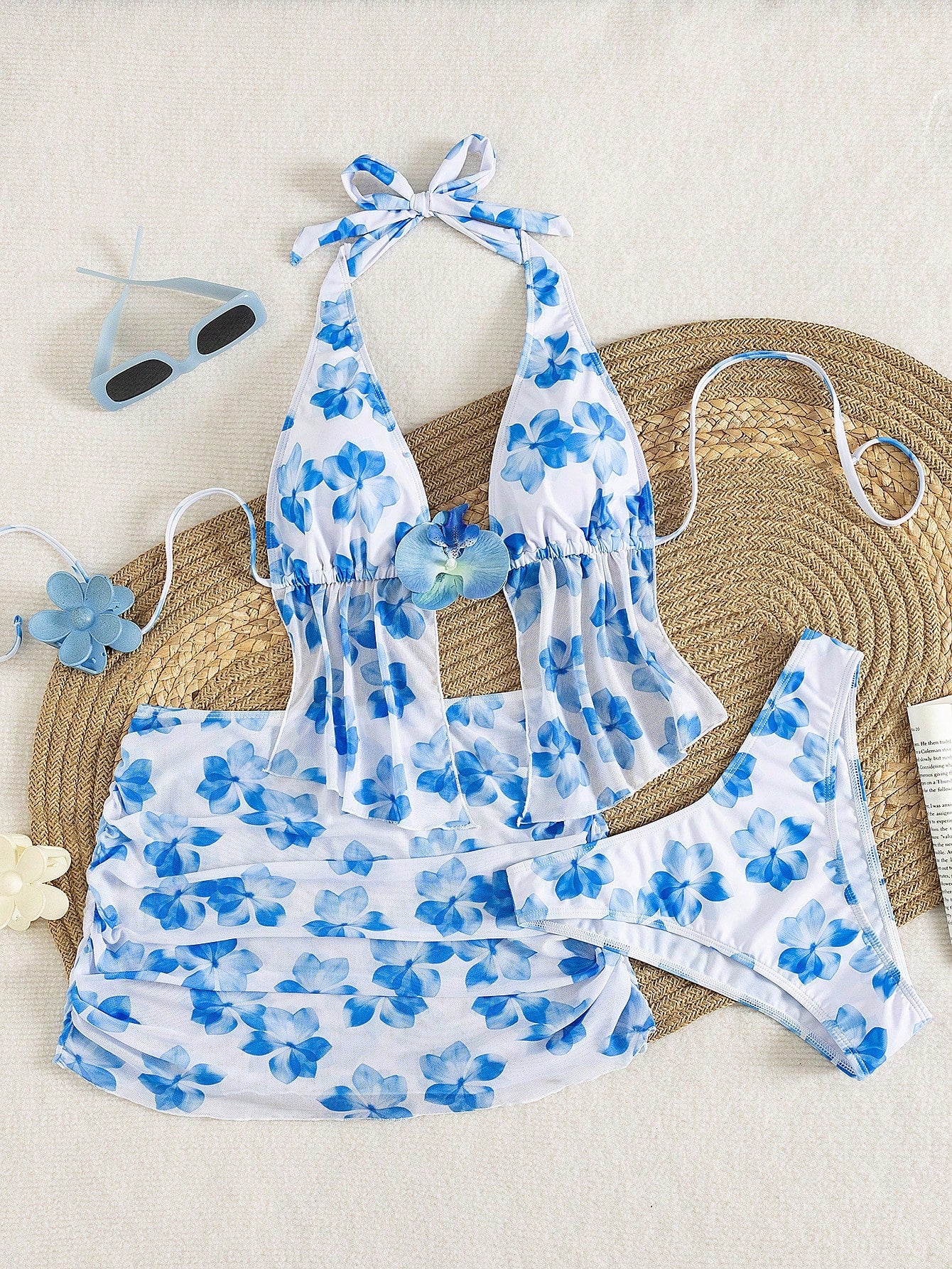Women's 3-piece floral bikini set featuring a multicolor plant print halter top with 3D rose detail, matching bikini bottoms, and short skirt cover-up