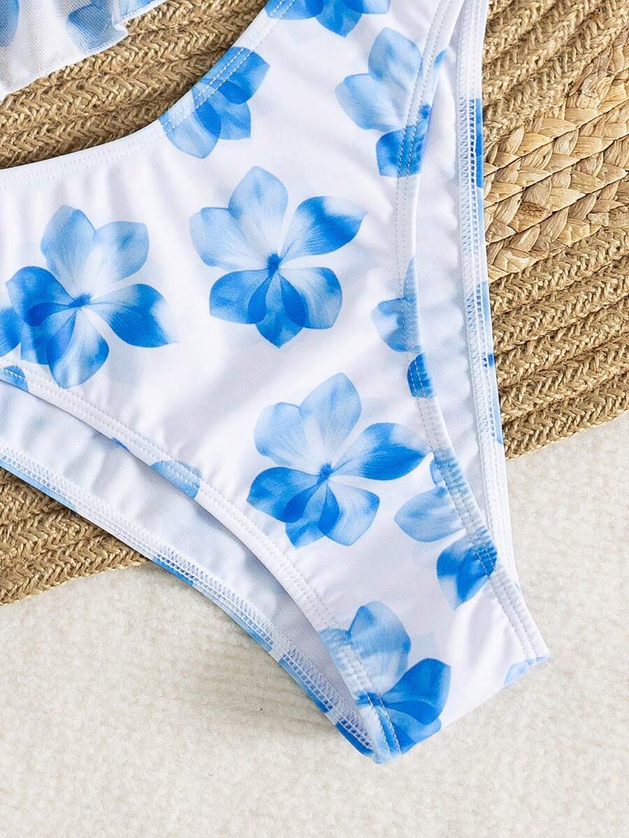 Women's 3-piece floral bikini set featuring a multicolor plant print halter top with 3D rose detail, matching bikini bottoms, and short skirt cover-up
