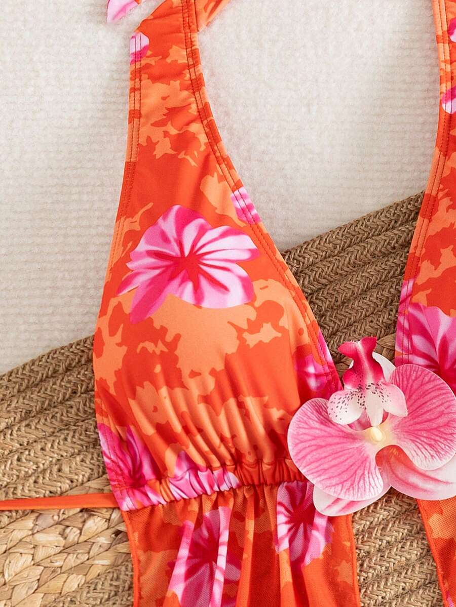 Women's 3-piece floral bikini set featuring a multicolor plant print halter top with 3D rose detail, matching bikini bottoms, and short skirt cover-up