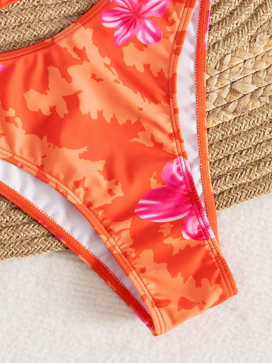 Women's 3-piece floral bikini set featuring a multicolor plant print halter top with 3D rose detail, matching bikini bottoms, and short skirt cover-up