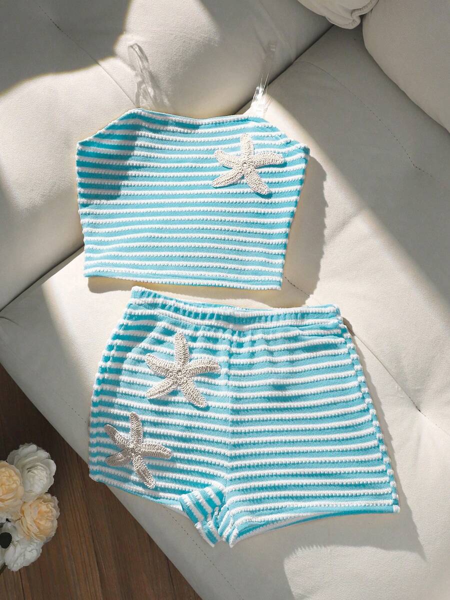 Tween girls black and white striped two-piece set featuring a spaghetti strap micro crop tank top with lettuce trim and ruffle hem paired with matching slim fit shorts.