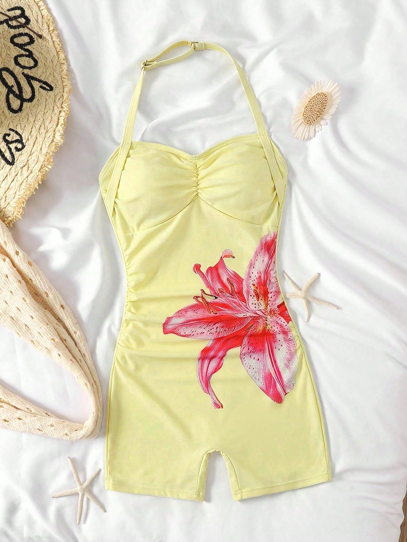 Apricot one-piece swimsuit for tween girls with a halter neckline, ruffle trim, textured knit fabric, fitted shape, and starfish metal decor.