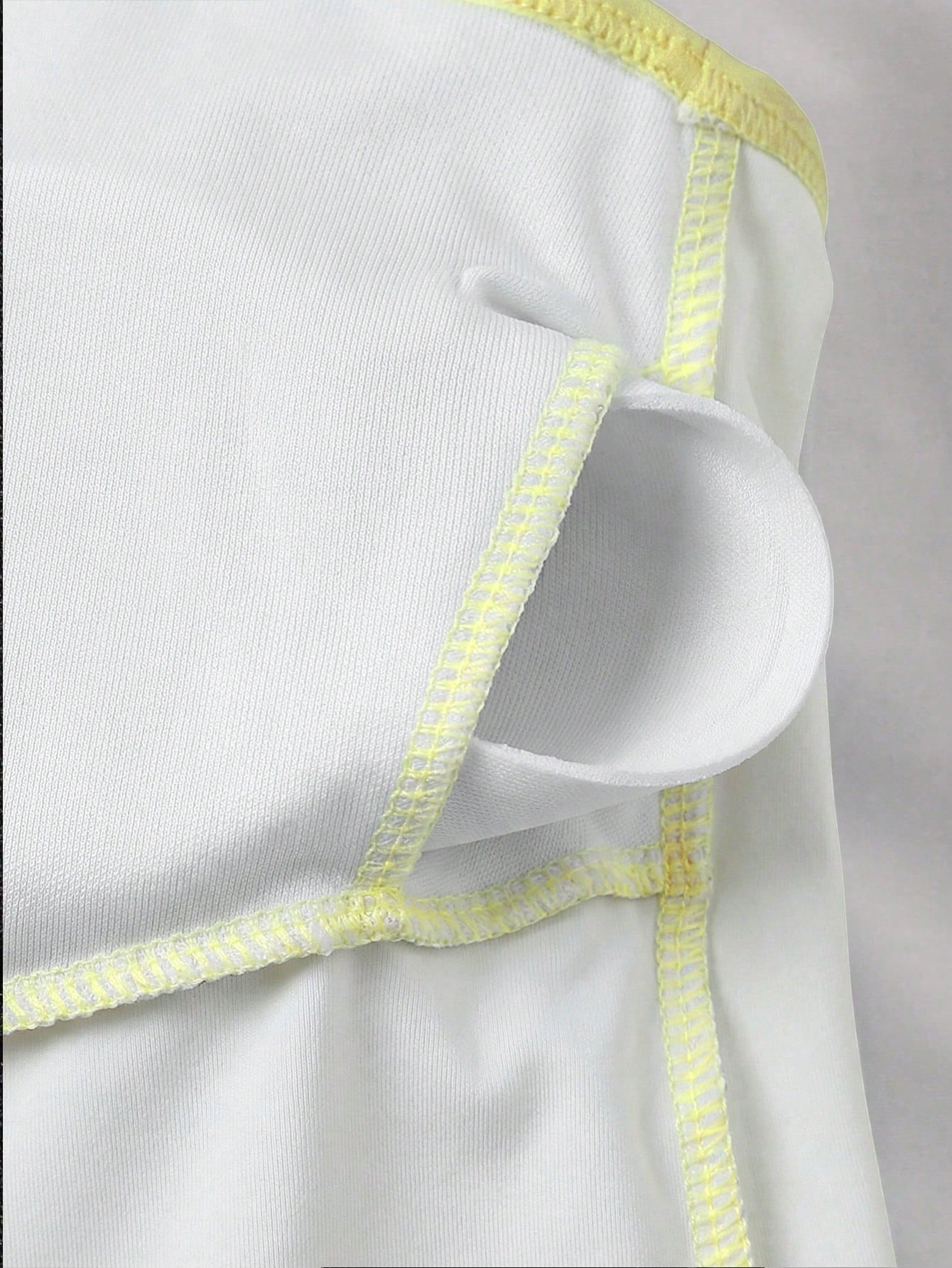 Apricot one-piece swimsuit for tween girls with a halter neckline, ruffle trim, textured knit fabric, fitted shape, and starfish metal decor.