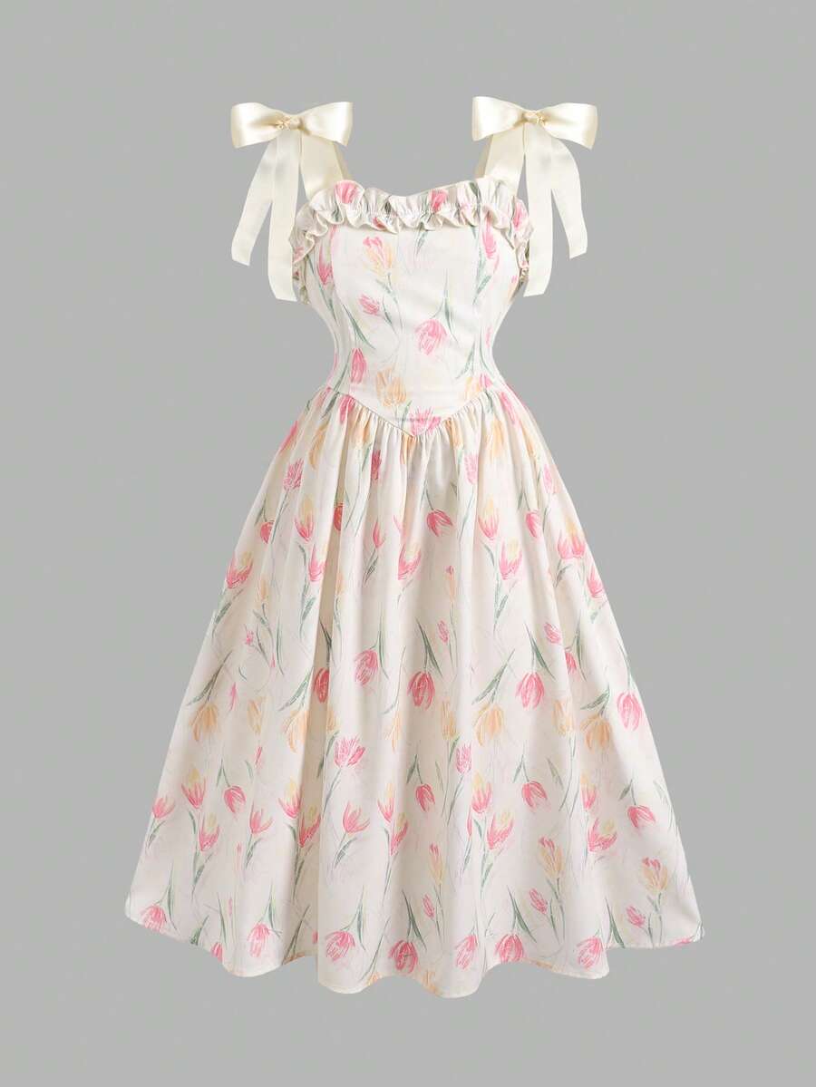 Tween girl apricot floral print midi dress with ruffle shoulder straps, shirred detail, and high waist A-line fit.