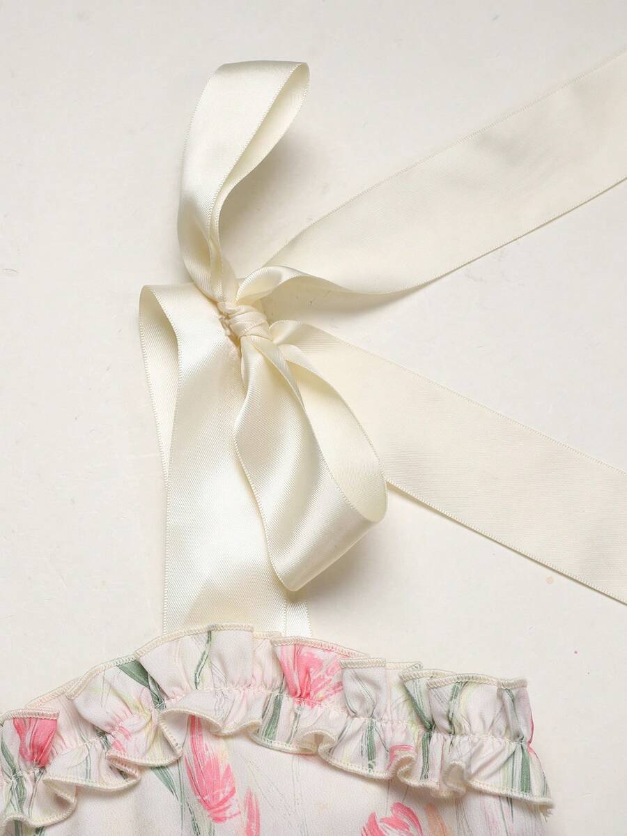 Tween girl apricot floral print midi dress with ruffle shoulder straps, shirred detail, and high waist A-line fit.