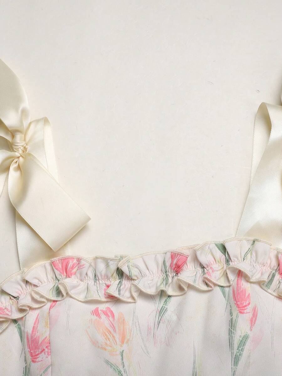Tween girl apricot floral print midi dress with ruffle shoulder straps, shirred detail, and high waist A-line fit.