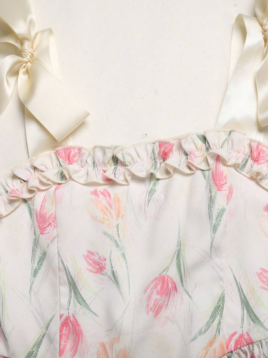 Tween girl apricot floral print midi dress with ruffle shoulder straps, shirred detail, and high waist A-line fit.