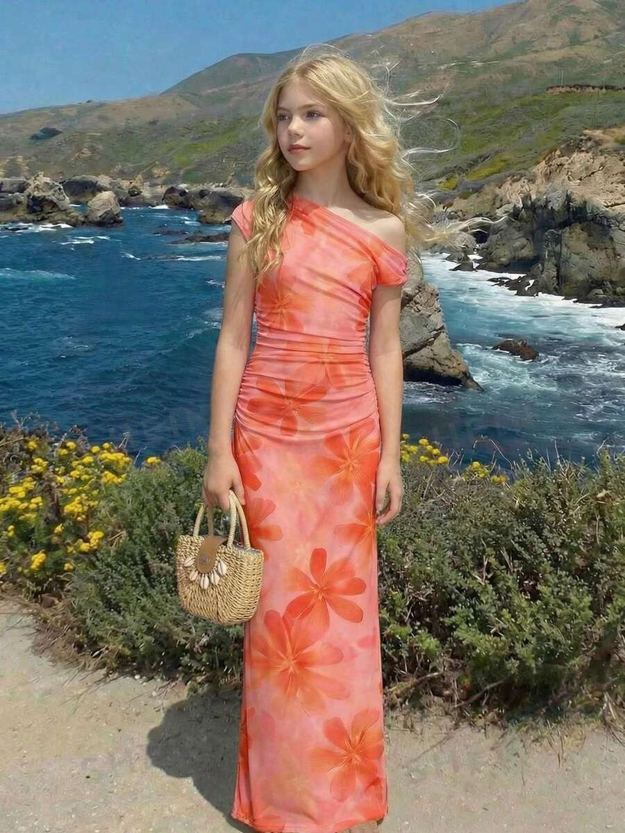 Tween girl wearing an elegant burgundy asymmetric bodycon long dress featuring 3D floral decoration, split pencil hem, and short sleeves.