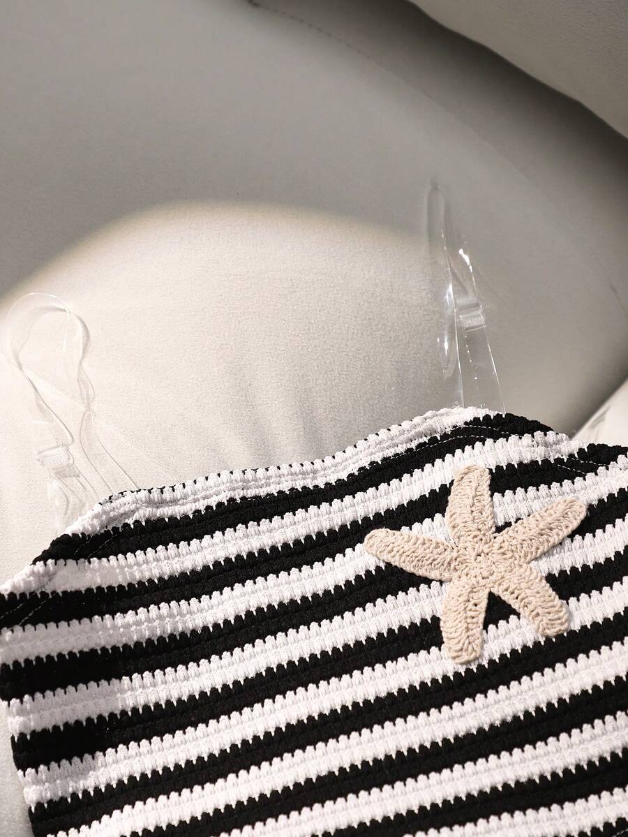 Tween girls black and white striped two-piece set featuring a spaghetti strap micro crop tank top with lettuce trim and ruffle hem paired with matching slim fit shorts.