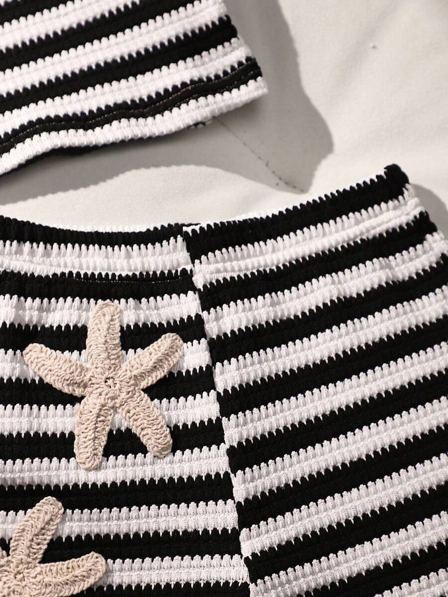 Tween girls black and white striped two-piece set featuring a spaghetti strap micro crop tank top with lettuce trim and ruffle hem paired with matching slim fit shorts.
