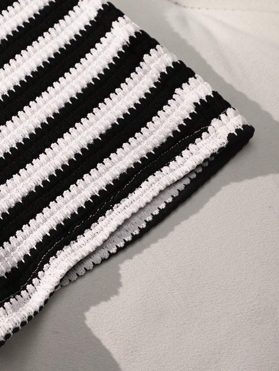 Tween girls black and white striped two-piece set featuring a spaghetti strap micro crop tank top with lettuce trim and ruffle hem paired with matching slim fit shorts.