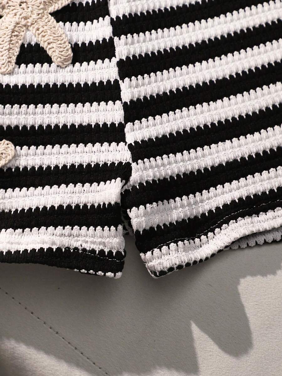 Tween girls black and white striped two-piece set featuring a spaghetti strap micro crop tank top with lettuce trim and ruffle hem paired with matching slim fit shorts.