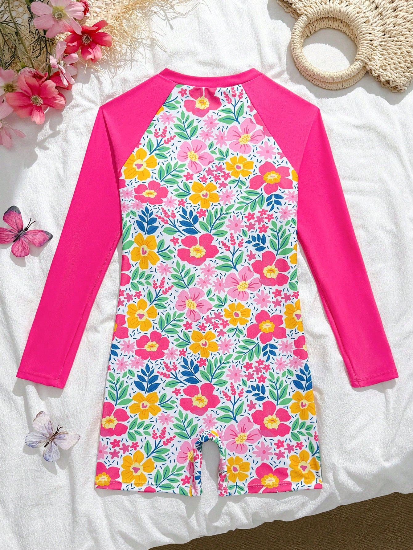 Tween girls one-piece swimsuit featuring a high neck, long sleeves, and shorts bottom, with a back zipper and strawberry plaid digital print on stretch knit fabric. Designed for swimming, vacation, and summer wear.