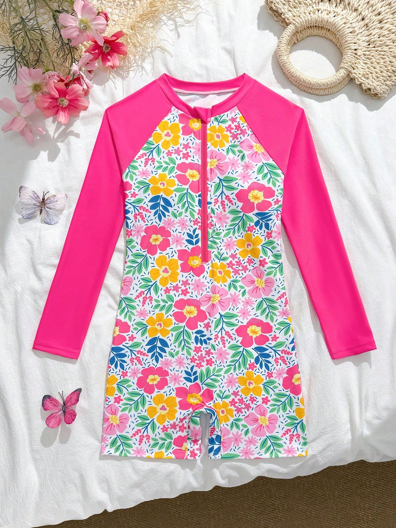 Tween girls one-piece swimsuit featuring a high neck, long sleeves, and shorts bottom, with a back zipper and strawberry plaid digital print on stretch knit fabric. Designed for swimming, vacation, and summer wear.