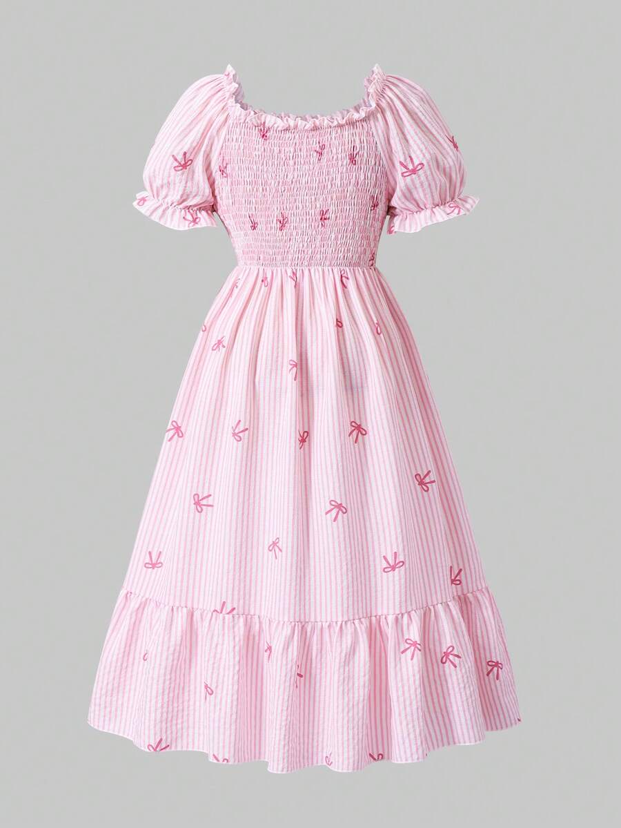 Tween girl wearing a black and white off-the-shoulder floral midi dress featuring short puff sleeves, high waist, and flounce hem.