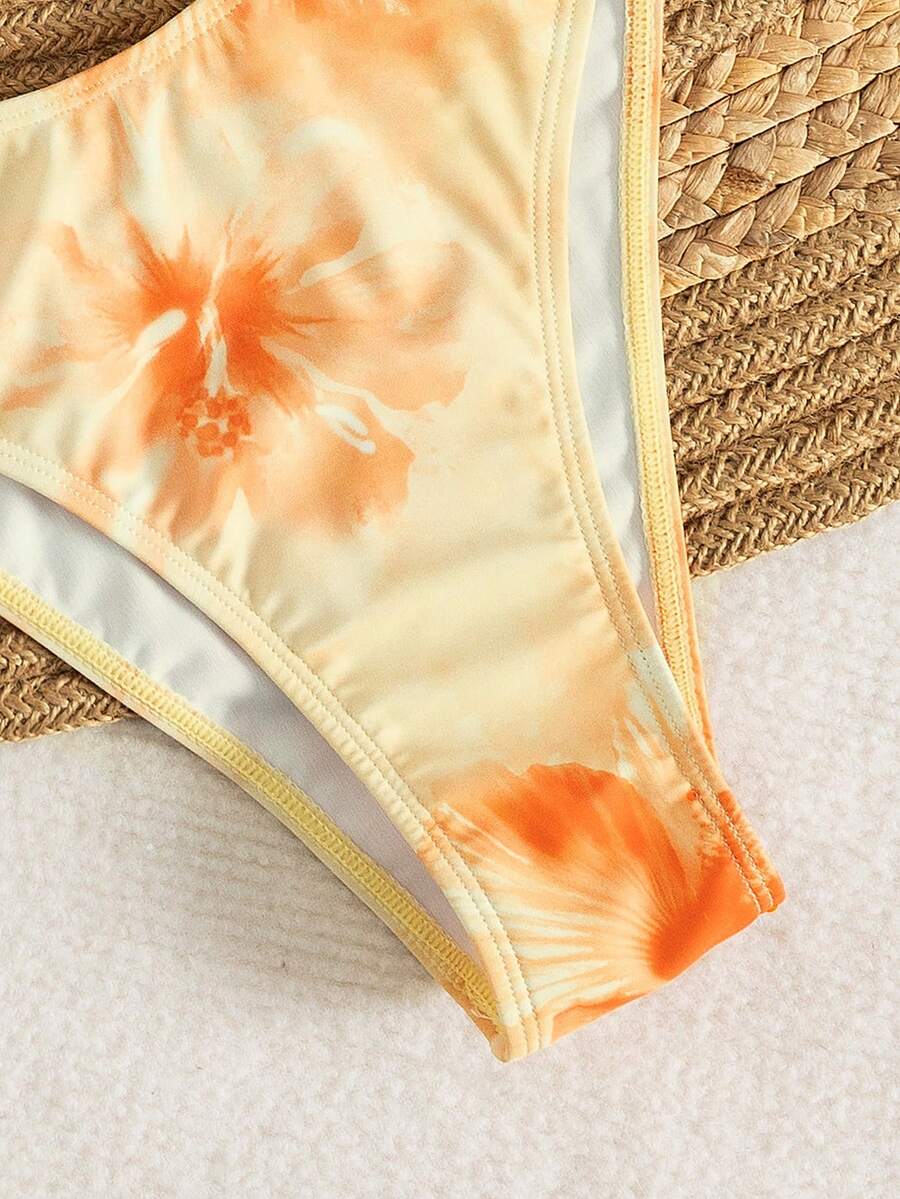 Women's 3-piece floral bikini set featuring a multicolor plant print halter top with 3D rose detail, matching bikini bottoms, and short skirt cover-up