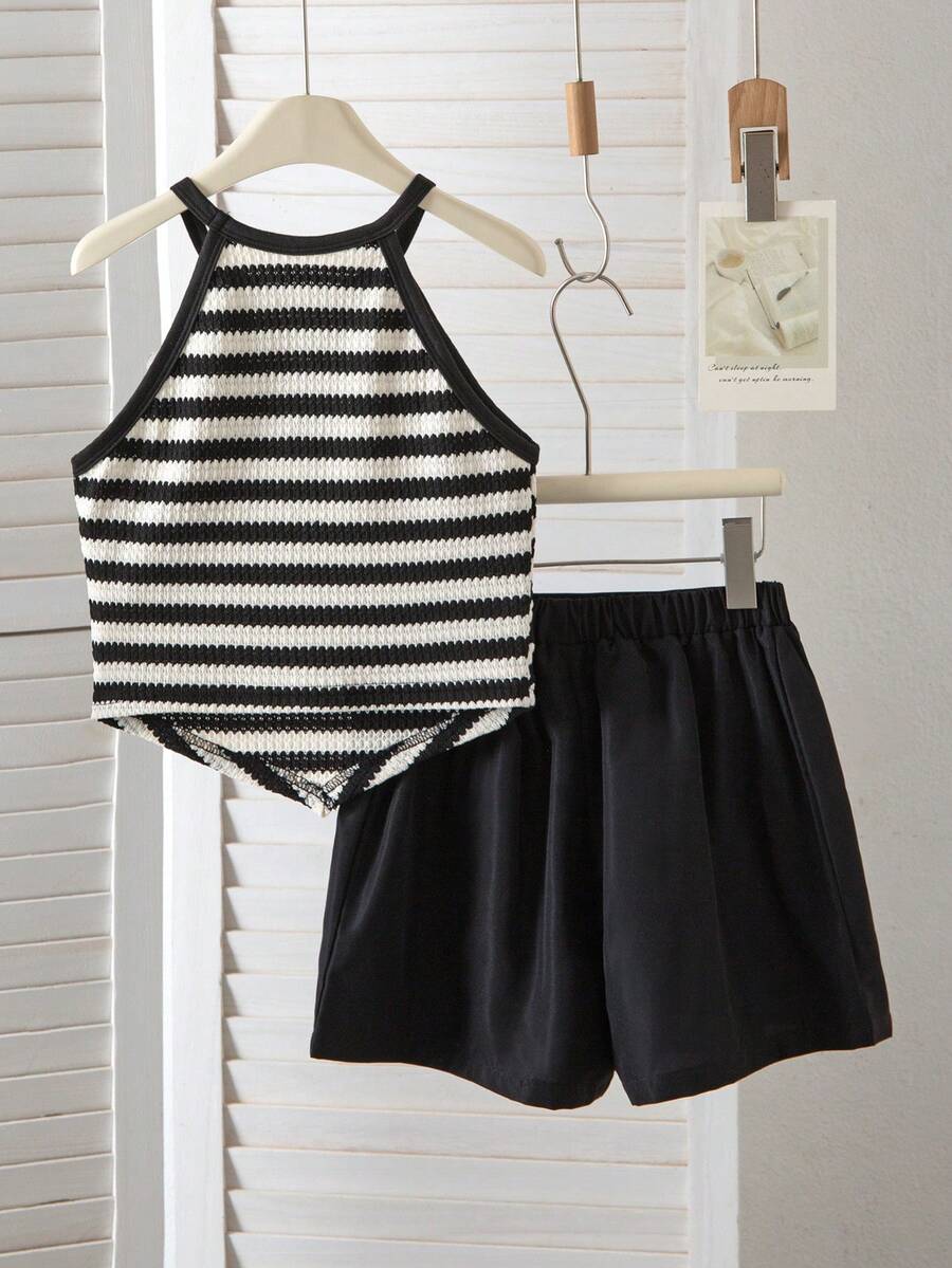 Girls 2-piece vacation outfit set with sleeveless halter knit crop top and graphic cargo shorts.