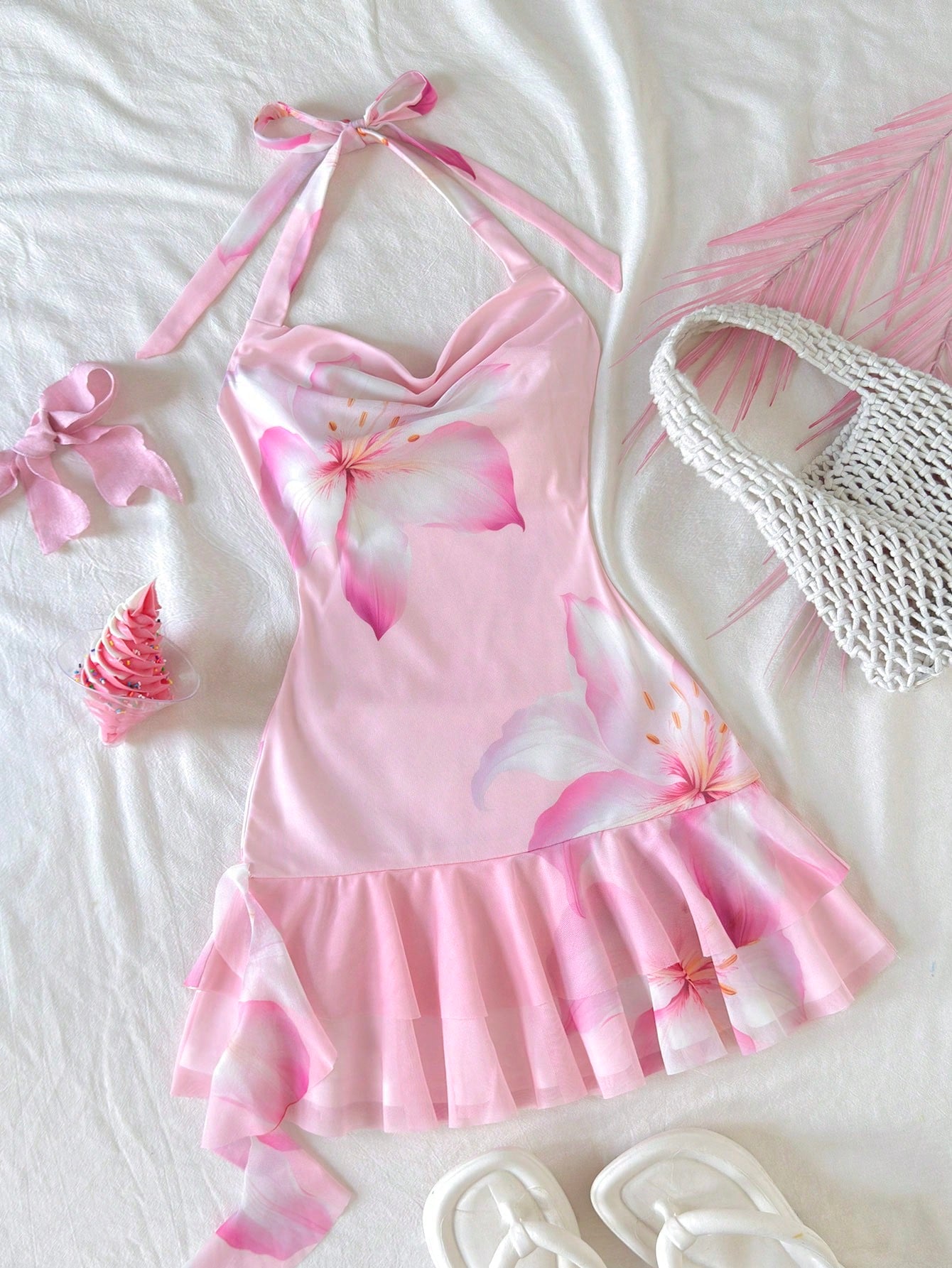 Tween girls sleeveless halter mini dress with ruffle tiered details, flounce hem, slim fit, lined body, and vacation-inspired plant print in khaki and pink tones.